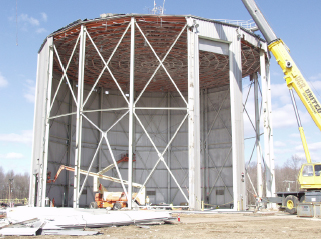 Crews dismantle a reactor facility.